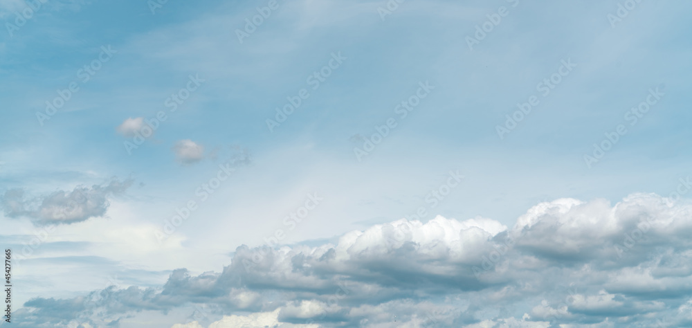 Panorama view of white fluffy clouds on blue sky. Close-up white cumulus clouds texture background. White puffy cloudscape. Beauty in nature. Soft-touch feeling like cotton. Beautiful cloudscape. Panorama view of white fluffy clouds on blue sky. Close-up white cumulus clouds texture background. White puffy cloudscape. Beauty in nature. Soft-touch feeling like cotton. Beautiful cloudscape.
