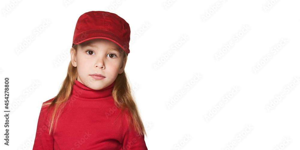 Girl wearing a red baseball cap isolated on white background Girl wearing a red baseball cap isolated on white background