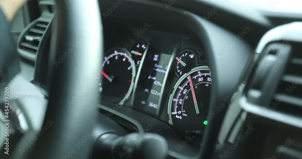 Instrument panel of a running car on city street Instrument panel of a running car on city street
