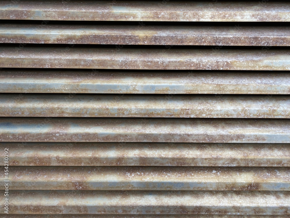 Fine details of rusted steel grating.