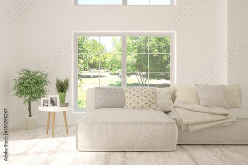 Wallpaper Mural White living room with sofa and summer landscape in window. Scandinavian interior design. 3D illustration Torontodigital.ca