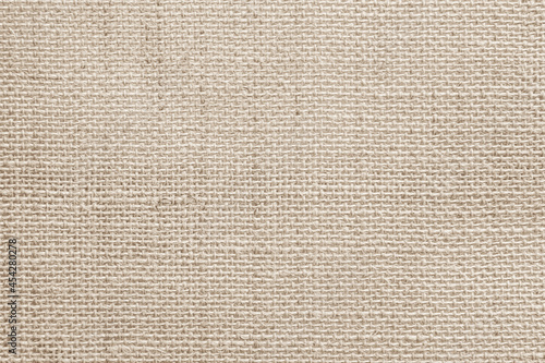 Brown sackcloth texture or background and empty space. Jute burlap canvas texture. Background for text and picture.