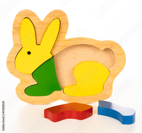 Wooden rabbit puzzle on white background