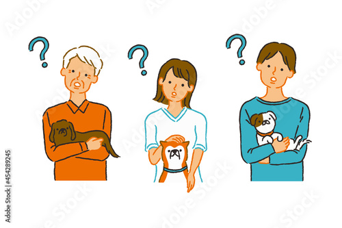 犬を抱えて疑問を持ついろんな飼い主