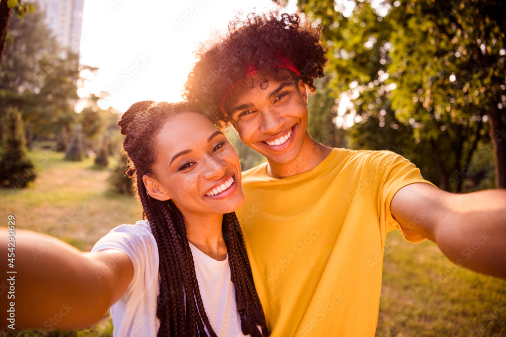 Self-portrait of handsome beautiful affectionate cheerful couple spending free spare time pastime fresh air at forest outdoors Self-portrait of handsome beautiful affectionate cheerful couple spending free spare time pastime fresh air at forest outdoors