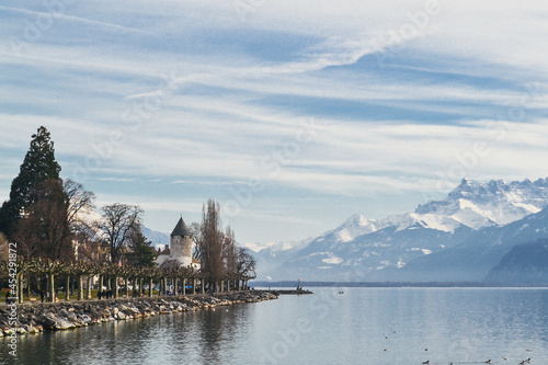 Small village by Geneva Lake with Swiss alps on the back