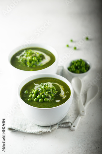 Healthy green pea soup with cream