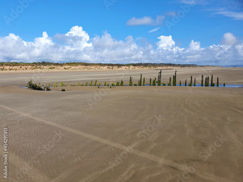 Shipwreck on the Cefn Sands beach at Pembrey Country Park in Carmarthenshire South Wales UK, which is a popular Welsh tourist travel resort and coastline landmark, stock photo image photo