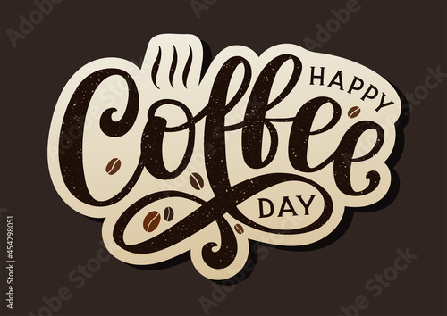 Happy coffee day lettering sticker decorated by coffee beans. Hand sketched design as coffee day banner.