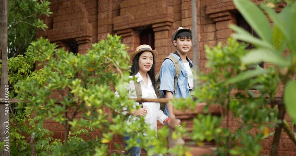 Couple hand together while visiting at ancient temple Couple hand together while visiting at ancient temple
