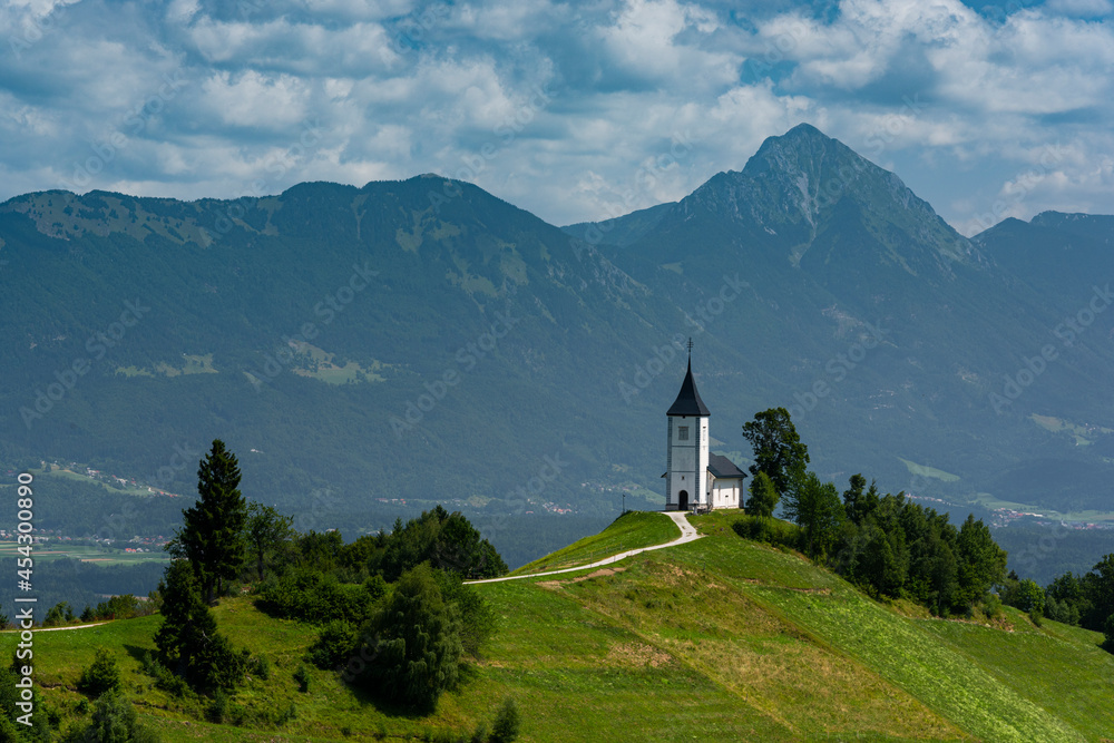 Scenic Church St Primoz in Jamnik Slovenia in Summer at Sunny Day. Alpine Landscape Scenic Church St Primoz in Jamnik Slovenia in Summer at Sunny Day. Alpine Landscape