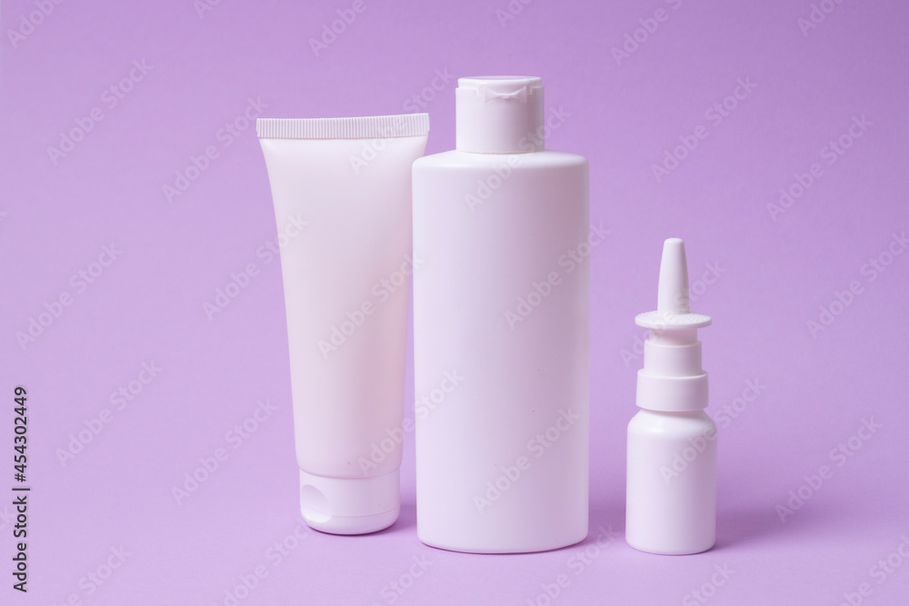 various plastic packaging for shampoo and cream on pink background various plastic packaging for shampoo and cream on pink background
