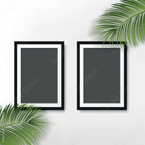 Black photo frame with palm leaves on white background. Vector