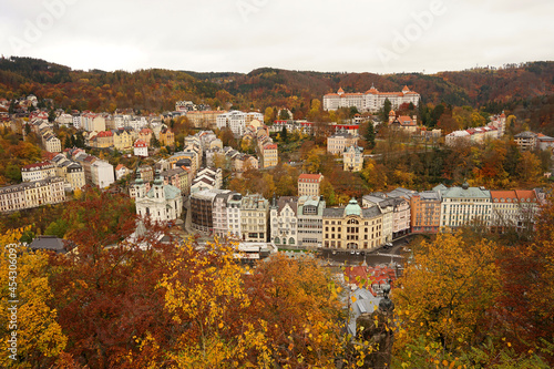 Karlovy Vary famous spa town aerial cityscape with hotels and historic buildings in autumn atmosphere with yellow coloured trees, Karlovy Vary, Czech Republic