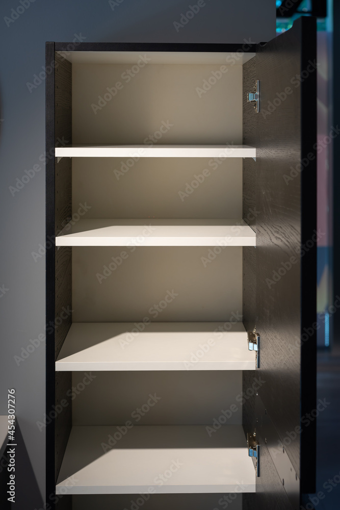 a empty black and white cabinet wood in modern and minimal style in front of wall in the restroom. a empty black and white cabinet wood in modern and minimal style in front of wall in the restroom.