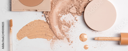 Set of liquid face powder and concealer brush strokes in different colour in texture, drop of skin tint serum , bronzing powder and smashed finishing powder isolated on white background. Make up.