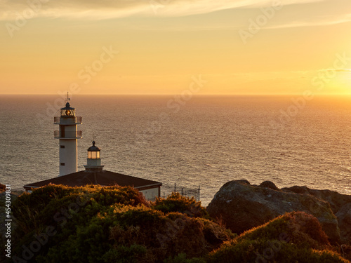 Tourinan Lighthouse in Muxia, Galician coast, Spain. Twice a year, at the beginning of spring and the end of summer, Cape Touriñan becomes the last shadow for the sunset in continental Europe. © ARCam