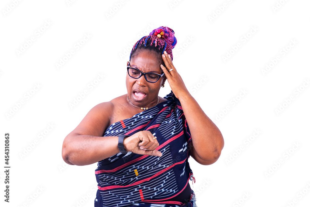 Worried mature woman looking at the time on the wrist watch. Worried mature woman looking at the time on the wrist watch.