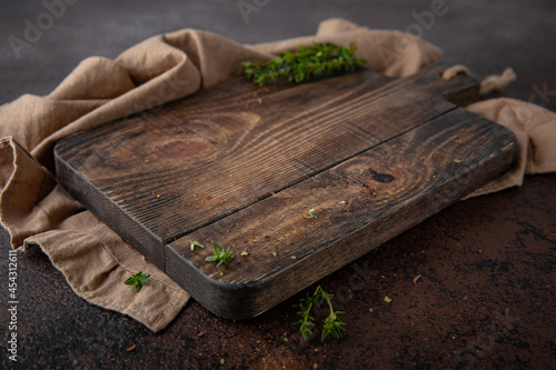 Brown background with cutting board for food photography. Free space for text