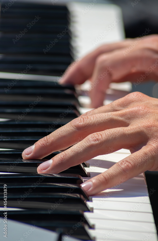 Fototapeta premium Pianist Play The Keys Of The Electronic