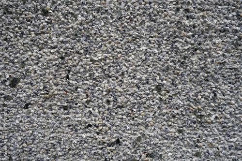 Wall covered with small stones.