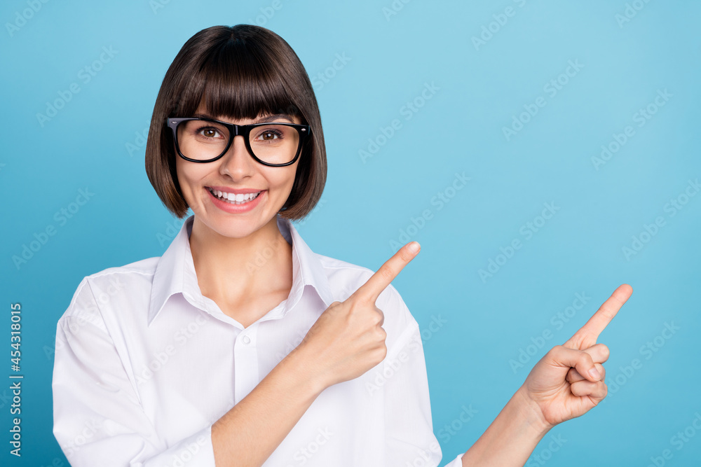 Portrait of attractive cheerful girl demonstrating copy empty space place ad idea isolated over bright blue color background Portrait of attractive cheerful girl demonstrating copy empty space place ad idea isolated over bright blue color background