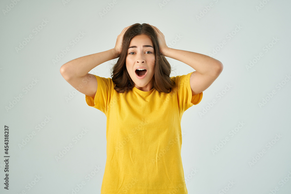emotional woman in yellow t-shirt with open mouth stress surprise emotional woman in yellow t-shirt with open mouth stress surprise