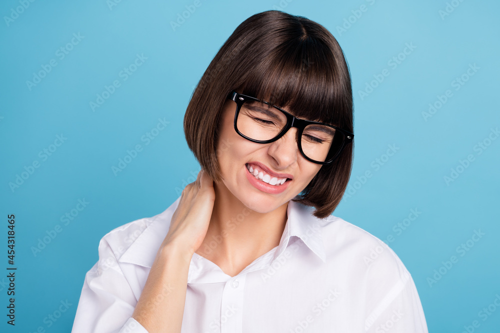 Portrait of attractive sick girl touching neck feeling bad suffering disease cold isolated over bright blue color background Portrait of attractive sick girl touching neck feeling bad suffering disease cold isolated over bright blue color background