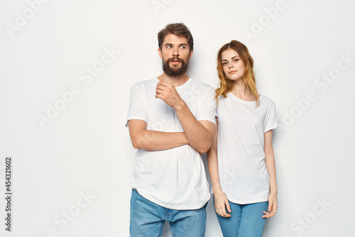 man and woman wearing white t-shirts fashion casual wear friendship together