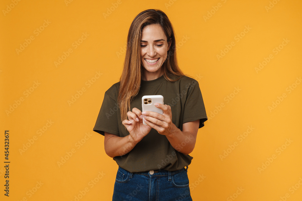 Happy mid aged casual woman using mobile phone Happy mid aged casual woman using mobile phone