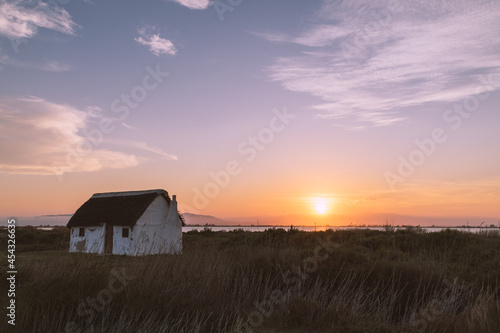 sunset over hut