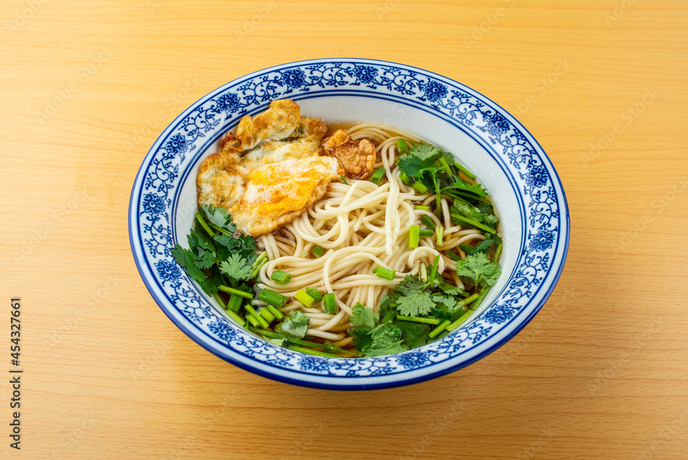 A bowl of egg noodles on the table A bowl of egg noodles on the table