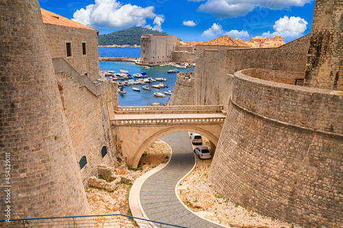 Summer cityscape - view of the bridge between the Revelin Fortress and the Ploce Gate in the Old Town of Dubrovnik on the Adriatic coast of Croatia
