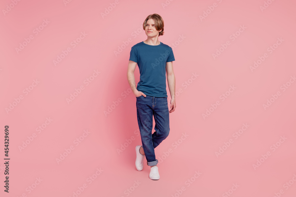 Photo of curious smart nice attractive guy look empty space think thoughts creative mood on pink background Photo of curious smart nice attractive guy look empty space think thoughts creative mood on pink background