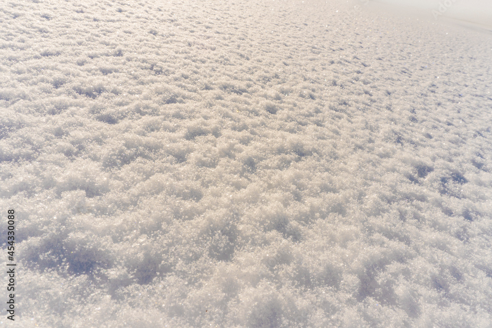 winter background of fresh shining snow texture