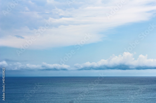 Blue sky and white clouds over sea