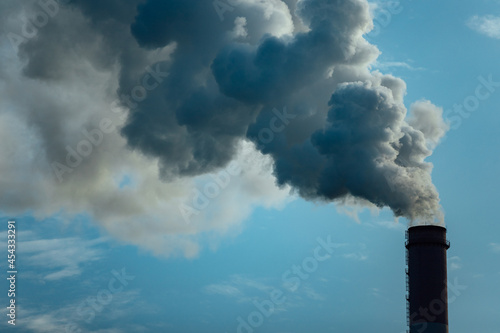 smoking chimneys of factories. pollution of the atmosphere by emissions and carbon dioxide. harmful emissions into the air. greenhouse gases from human activities