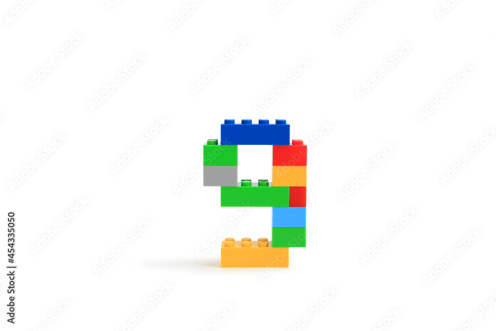 Arabic number symbol 9 from colorful plastic brick block constructor isolated on white background. Image with Clipping path