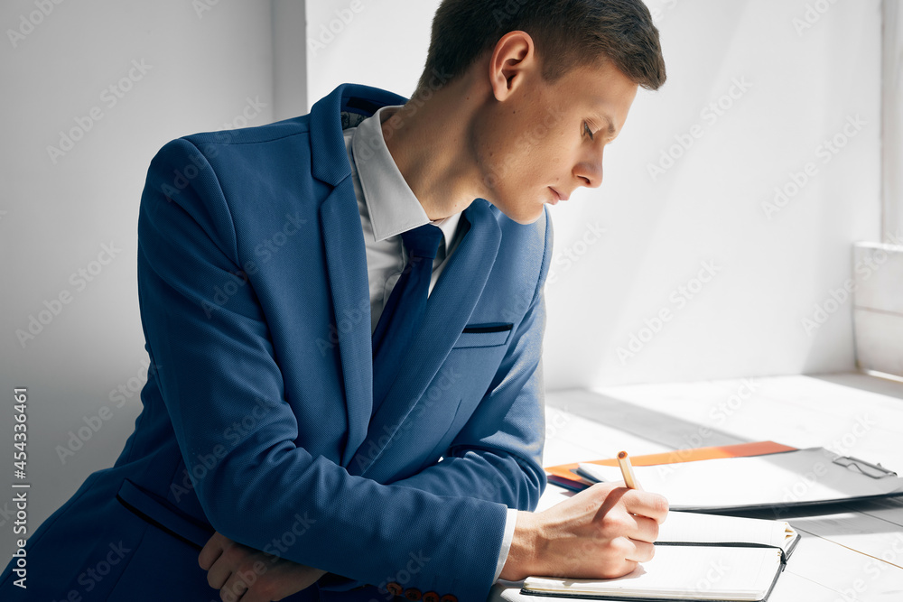 business man manager in office near window documents work business man manager in office near window documents work