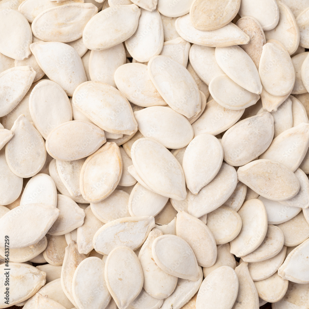 Closeup top view of pumpkin seeds. Food backdrop Closeup top view of pumpkin seeds. Food backdrop