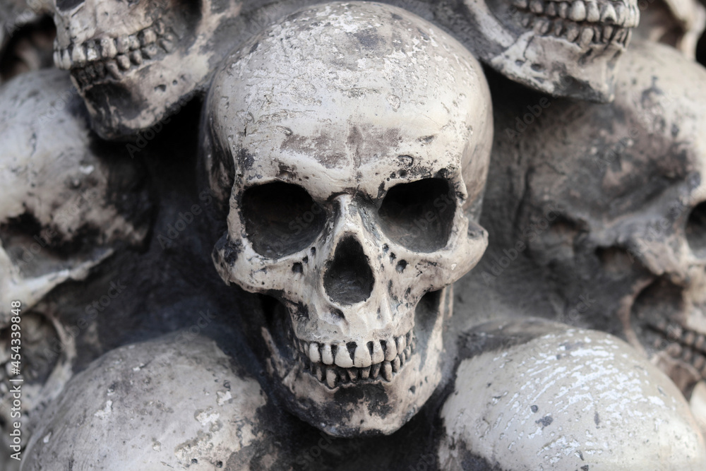 Artificial human skull close-up as background for postcard for congratulations to Halloween Artificial human skull close-up as background for postcard for congratulations to Halloween