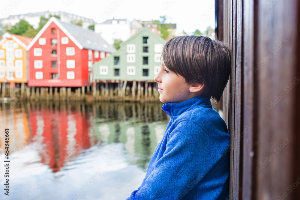 Cute child, boy, visiting Trondheim, Norway during the summer