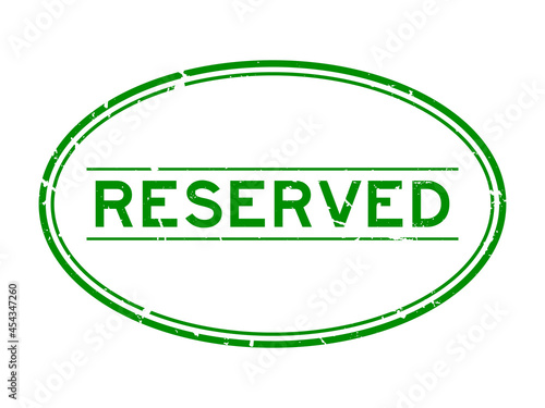Grunge green reserved word oval rubber seal stamp on white background