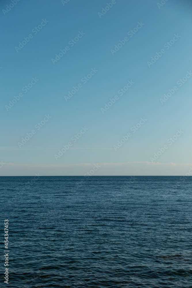 Blue sky and endless sea. View of the open ocean.