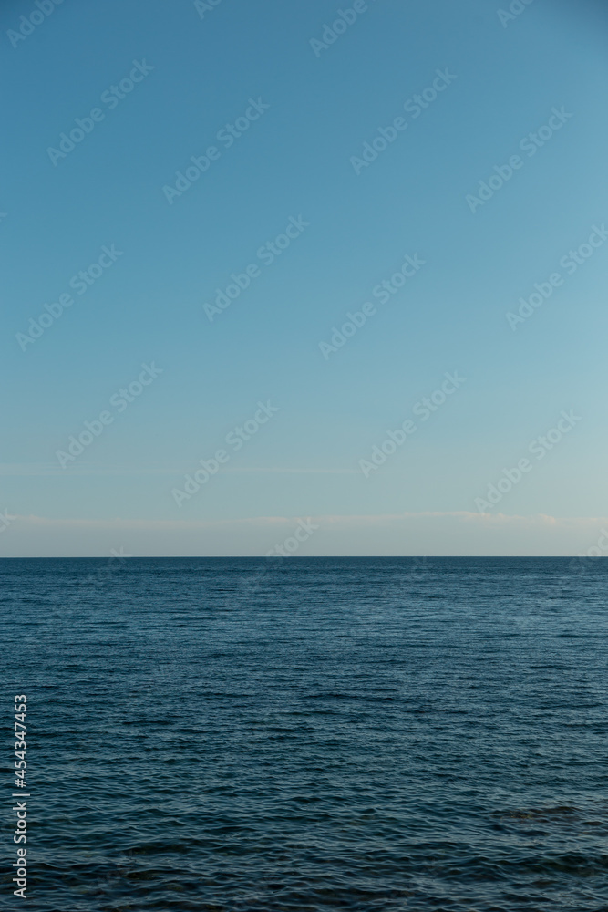 Blue sky and endless sea. View of the open ocean. Blue sky and endless sea. View of the open ocean.