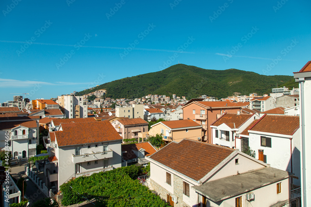 Red tiled roofs of a European city. View of the city.