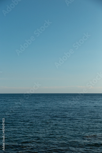 Blue sky and endless sea. View of the open ocean.