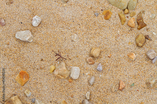 Texture of sand and stones on the beach photo