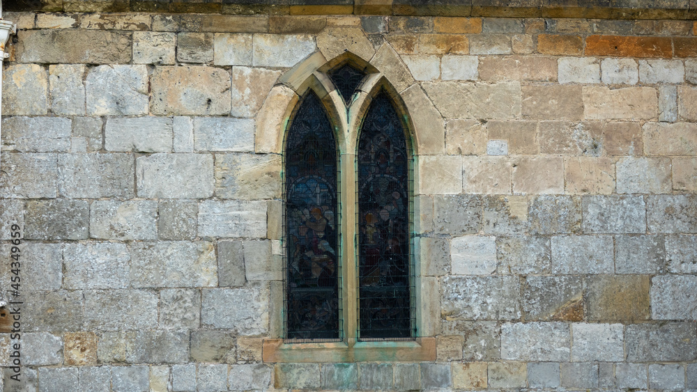 Medieval window in stone wall Medieval window in stone wall