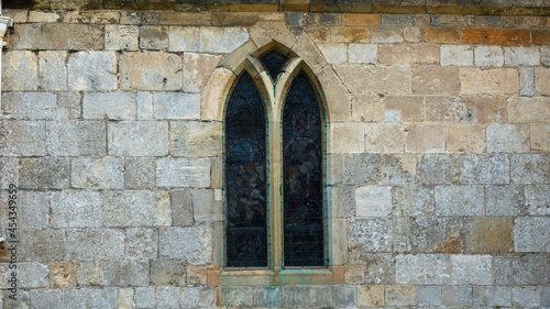 Medieval window in stone wall